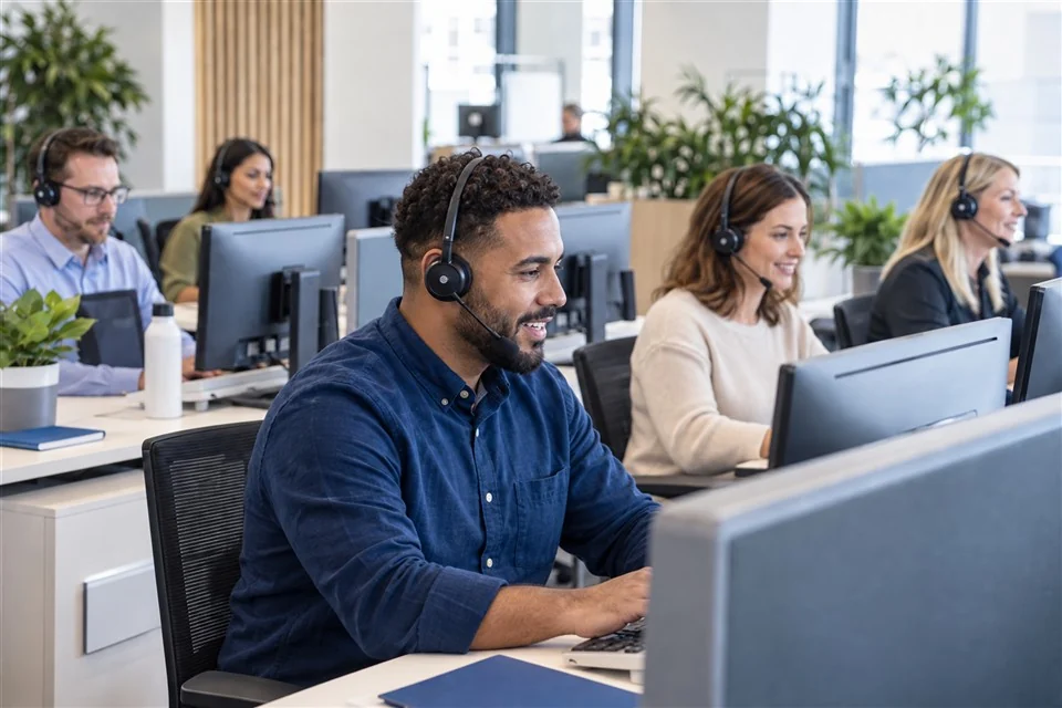 Illustrative scene: Call centre agents handling customer calls